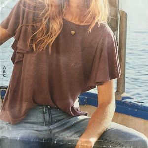 A luxe tee with romantic flutter sleeves.  Linen/